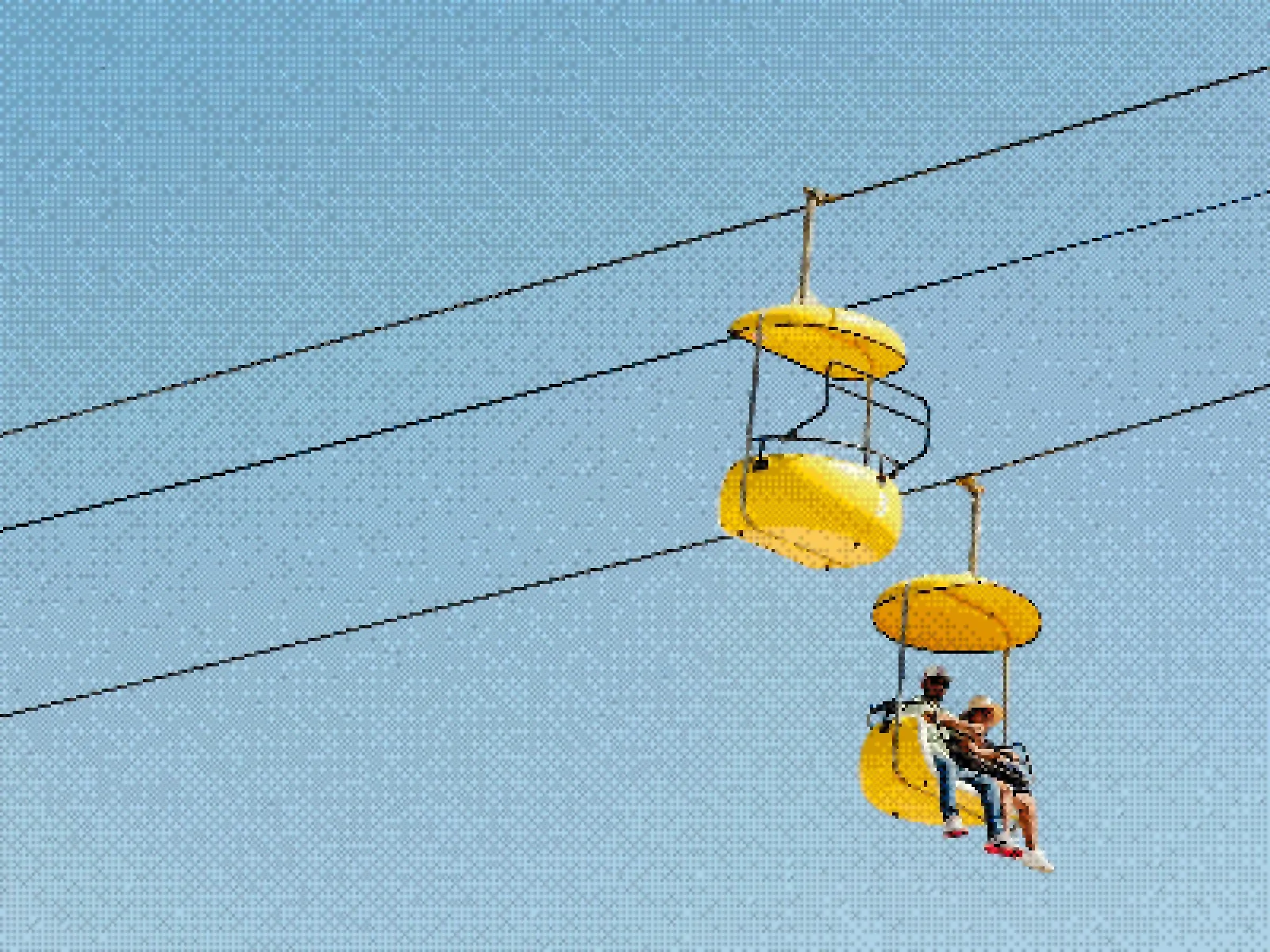 Dithered photograph of yellow cable cars climbing parallel lines through a blue sky