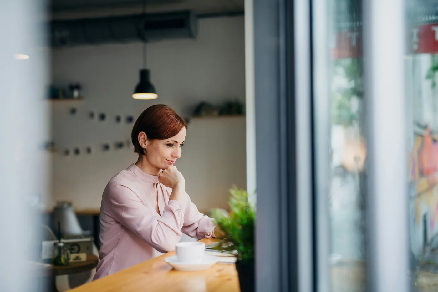 Person enjoying coffee while reading
